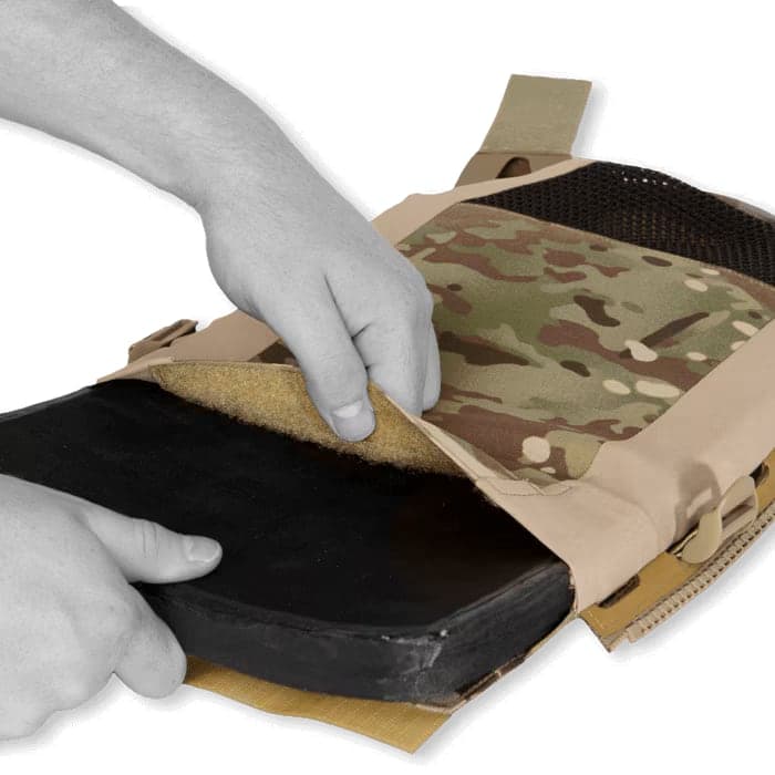 Hands sliding an armor plate into the JPC 2.0 Maritime plate pocket