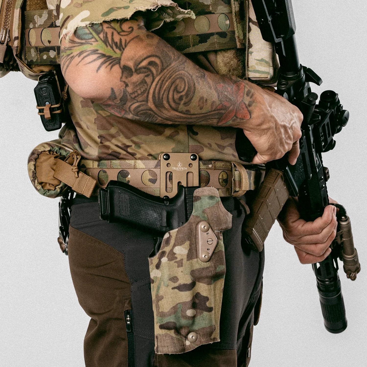 Bora Belt in Multicam worn with holster and pouches, side view