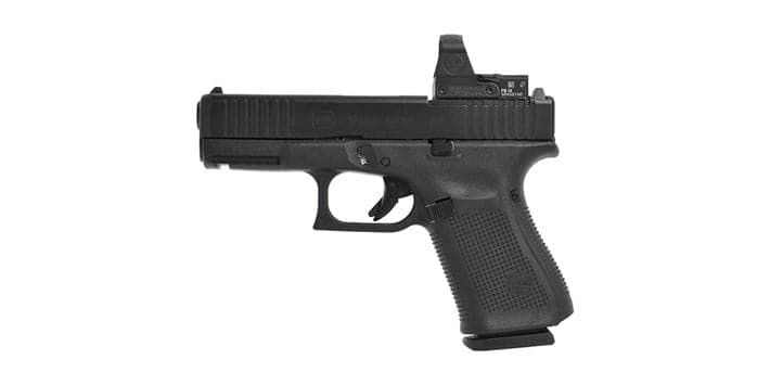 Black compact pistol with a slide-mounted red dot sight, right side profile