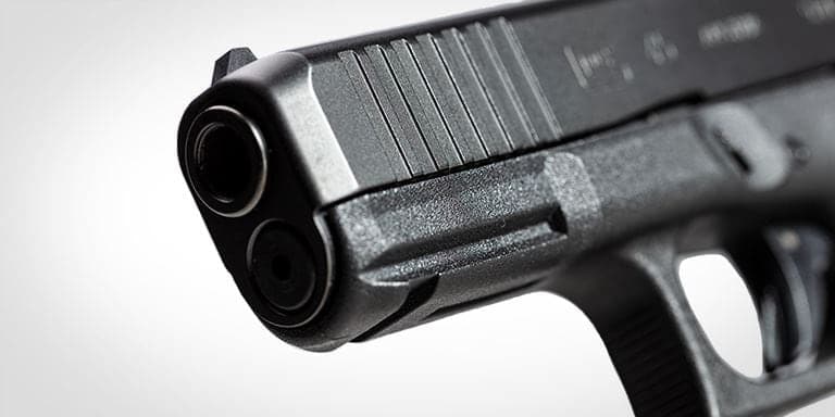 Close view of the G45 muzzle and slide front serrations