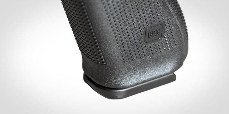 Close view of the textured G45 grip and flared magazine well