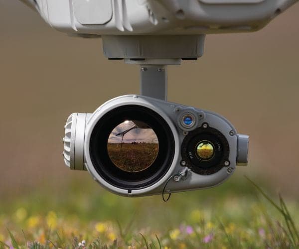 Noctis dual IR payload hanging beneath an Indago 4 above a meadow