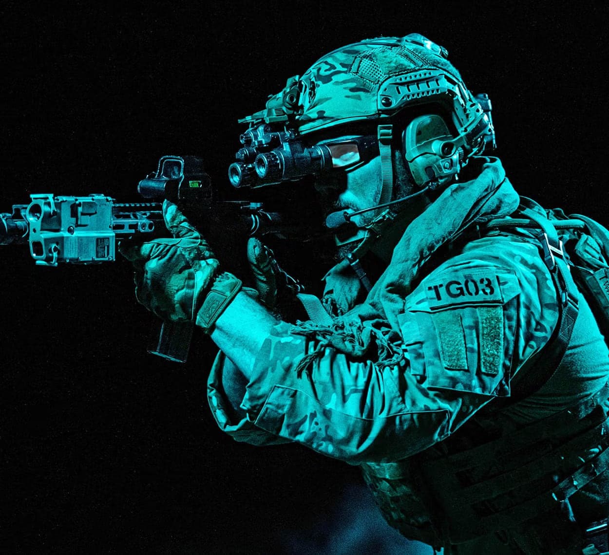 Operator aiming a rifle with a helmet-mounted AN/PVS-31A, stylised night image