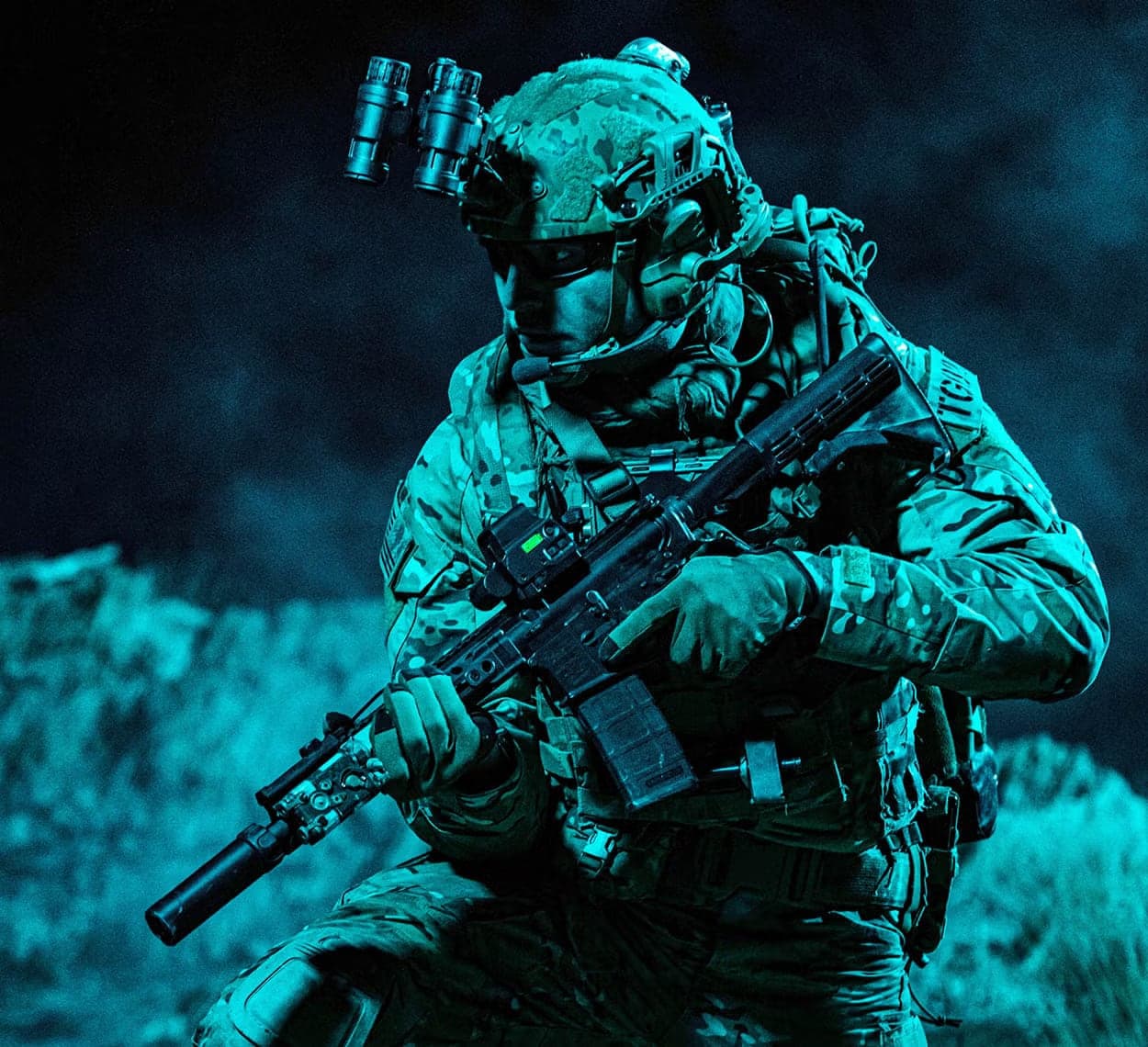 Soldier with night vision goggles and rifle, stylised night image