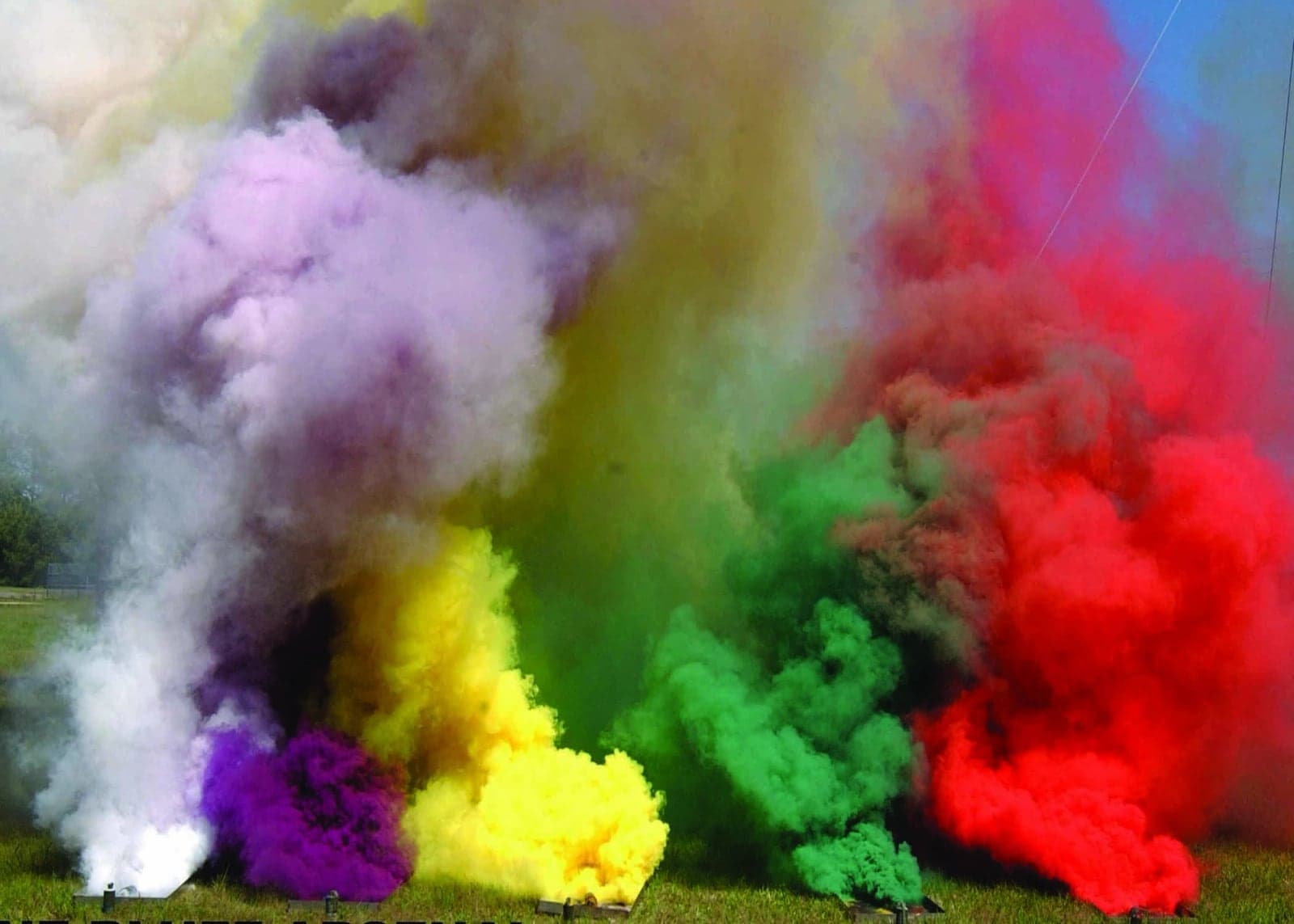 M18 smoke grenades producing violet, yellow, green and red smoke during a demonstration