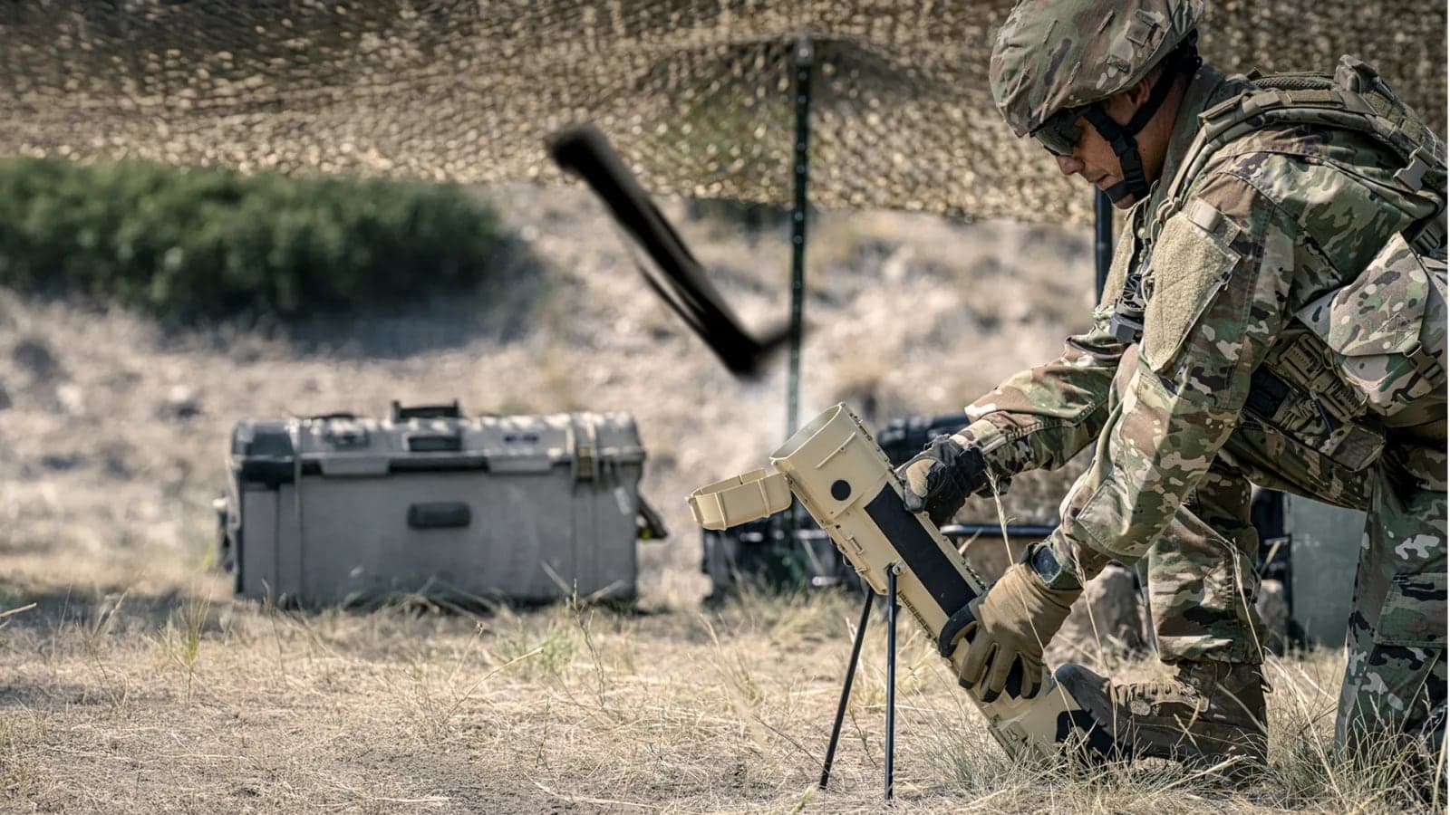 Soldier setting up a Switchblade 300 launch tube in a field position