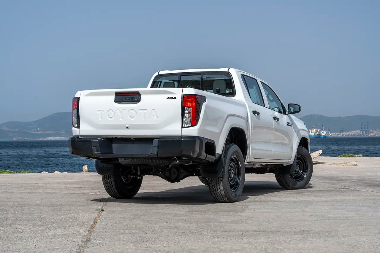 White Hilux Double Cab rear three-quarter view